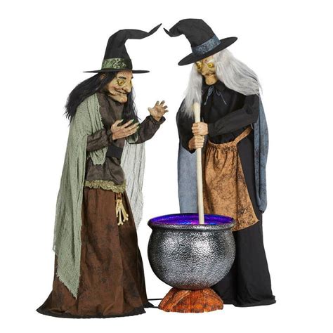 Animatromic witch with cauldron